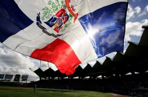 SAN JUAN, PUERTO RICO – MARCH 13: A fan flies the Dominican Republic flag during the game against Cuba during Round 2 of the World Baseball Classic on March 13, 2006 at Hiram Bithorn Stadium in San Juan, Puerto Rico. (Photo by Al Bello/Getty Images)