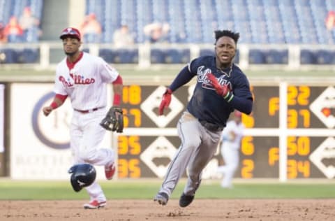 PHILADELPHIA, PA – AUGUST 30: Ozzie Albies #1 of the Atlanta Braves runs past Pedro Florimon #18 of the Philadelphia Phillies on his way to score a run in the top of the ninth inning in game two of the doubleheader at Citizens Bank Park on August 30, 2017 in Philadelphia, Pennsylvania. The Braves defeated the Phillies 5-2. (Photo by Mitchell Leff/Getty Images)