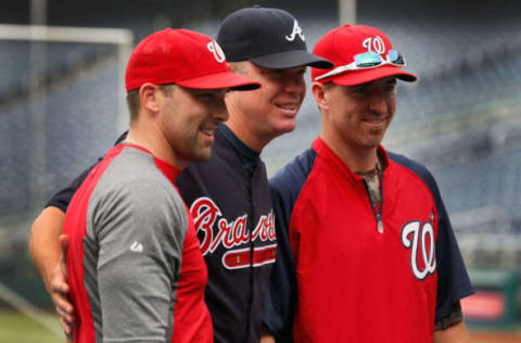 WASHINGTON, DC – AUGUST 20: Chipper Jones #10 of the Atlanta Braves (C) poses for a photo with Mark DeRosa #7 (L) and Adam LaRoche #25 (R) of the Washington Nationals before the start of their game at Nationals Park on August 20, 2012 in Washington, DC. (Photo by Rob Carr/Getty Images)