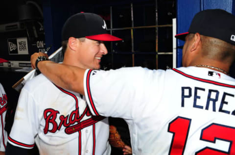 ATLANTA, GA – JUNE 10: Kelly Johnson #24 (L) of the Atlanta Braves celebrates with Coach Eddie Perez #12 after the game against the San Diego Padres at Turner Field on June 10, 2015 in Atlanta, Georgia. (Photo by Scott Cunningham/Getty Images)