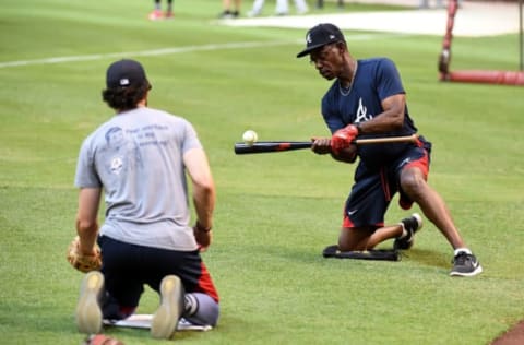 PHOENIX, AZ – JULY 24: Third base coach Ron Washington #37 of the Atlanta Braves hits short hoppers to Dansby Swanson #7 prior to a game against the Arizona Diamondbacks at Chase Field on July 24, 2017 in Phoenix, Arizona. (Photo by Norm Hall/Getty Images)