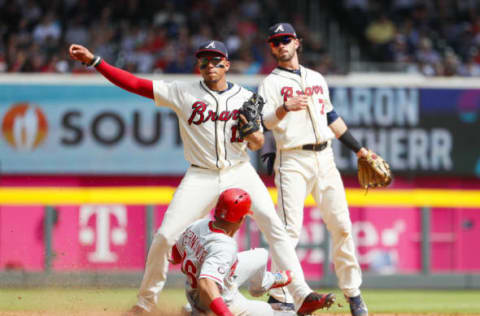 ATLANTA, GA – SEPTEMBER 24: Dansby Swanson #7 of the Atlanta Braves tosses to Johan Camargo #17 who throws to first for a conversion of a double play as Cesar Hernandez #16 of the Philadelphia Phillies is forced out at second in the sixth inning of an MLB game at SunTrust Park on September 24, 2017 in Atlanta, Georgia. (Photo by Todd Kirkland/Getty Images)