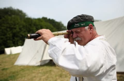 WATERLOO, BELGIUM – JUNE 17: A historical re-enactor looks through a telescope in the Allied Bivouac camp on June 17, 2015 in Waterloo, Belgium. (Photo by Dan Kitwood/Getty Images)