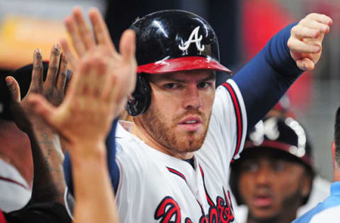 ATLANTA, GA – SEPTEMBER 22: Freddie Freeman #5 of the Atlanta Braves is congratulated by teammates after scoring a first inning run against the Philadelphia Phillies at SunTrust Park on September 22, 2017 in Atlanta, Georgia. (Photo by Scott Cunningham/Getty Images)