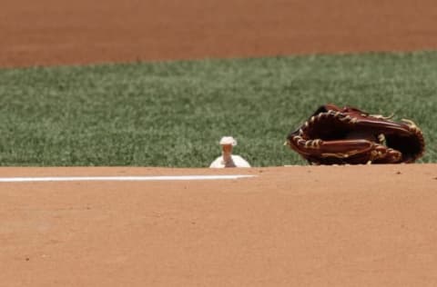 BOSTON, MA – JUNE 24: A glove and the rosin bag sit on the mound before the interleague game between the Boston Red Sox and the Atlanta Braves at Fenway Park on June 23, 2012 in Boston, Massachusetts. (Photo by Winslow Townson/Getty Images)