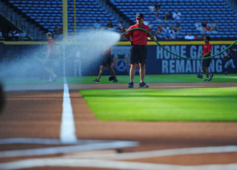 ATLANTA, GA – JUNE 29: Head Groundskeeper Ed Mangin of the Atlanta Braves waters down the infield before the game against the Cleveland Indians at Turner Field on June 29, 2016 in Atlanta, Georgia. (Photo by Scott Cunningham/Getty Images)