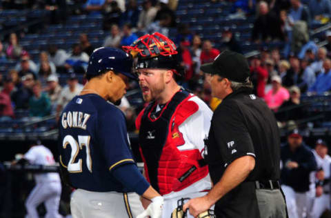 ATLANTA, GA – SEPTEMBER 25: Carlos Gomez #27 of the Milwaukee Brewers is confranted at home plate by Brian McCann #16 of the Atlanta Braves after hitting a first inning home run at Turner Field on September 25, 2013 in Atlanta, Georgia. (Photo by Scott Cunningham/Getty Images)