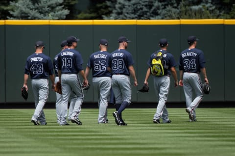 DENVER, CO – JULY 21: The Atlanta Braves relief pitchers head for the bullpen prior to facing the Colorado Rockies. Reinforcements are needed but who and how much? (Photo by Doug Pensinger/Getty Images)