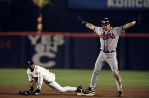 12 Oct 1998: Outfielder Ryan Klesko #18 of the Atlanta Braves in action against infielder Quilvio Veras #4 of the San Diego Padres during the National League Championships Series game at Qualcomm Stadium in San Diego, California. The Braves defeated the Padres 7-6. Mandatory Credit: Harry How /Allsport