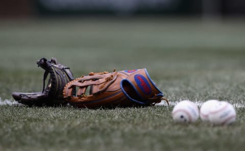 CHICAGO, IL – APRIL 13: Gloves and balls are seen on the field before the Chicago Cubs take on the Atlanta Braves at Wrigley Field on April 13, 2018, in Chicago, Illinois. The Braves defeated the Cubs 4-0. (Photo by Jonathan Daniel/Getty Images)