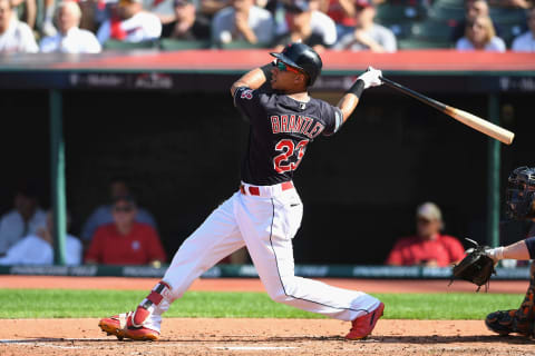 CLEVELAND, OH – OCTOBER 08: Michael Brantley #23 of the Cleveland Indians hits a sacrifice fly ball in the third inning to score Yan Gomes #7 (not pictured) against the Houston Astros during Game Three of the American League Division Series at Progressive Field on October 8, 2018 in Cleveland, Ohio. (Photo by Jason Miller/Getty Images)