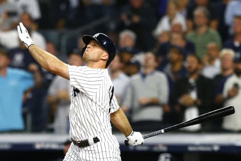 NEW YORK, NEW YORK – OCTOBER 09: Brett Gardner #11 of the New York Yankees hits a sac fly to score Gary Sanchez #24 against Rick Porcello #22 of the Boston Red Sox during the fifth inning in Game Four of the American League Division Series at Yankee Stadium on October 09, 2018 in the Bronx borough of New York City. (Photo by Mike Stobe/Getty Images)