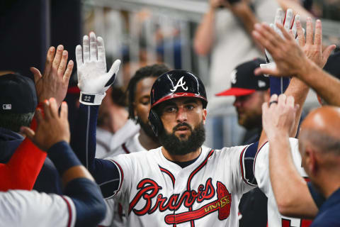 ATLANTA, GA – APRIL 13: Nick Markakis #22 of the Atlanta Braves is congratulated in the dugout after hitting a home run against the New York Mets during the fourth inning at SunTrust Park on April 13, 2019 in Atlanta, Georgia. (Photo by John Amis/Getty Images)