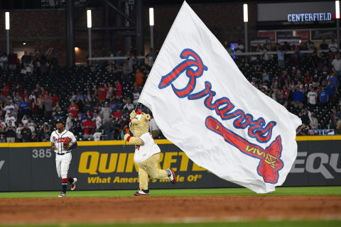 ATLANTA, GA – APRIL 13: Ronald  Acuna Jr. #13 of the Atlanta Braves is followed by Blooper the team mascot after an 11-7 win over the New York Mets at SunTrust Park on April 13, 2019 in Atlanta, Georgia. The Braves won 11-7. (Photo by John Amis/Getty Images)