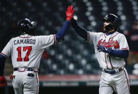 CLEVELAND, OH – APRIL 20: Dansby Swanson #7 of the Atlanta Braves celebrates with Johan Camargo #17 after hitting a two run home run off Dan Otero #61 of the Cleveland Indians during the seventh inning of Game 2 of a doubleheader at Progressive Field on April 20, 2019 in Cleveland, Ohio. The Braves defeated the Indians 8-7. (Photo by Ron Schwane/Getty Images)