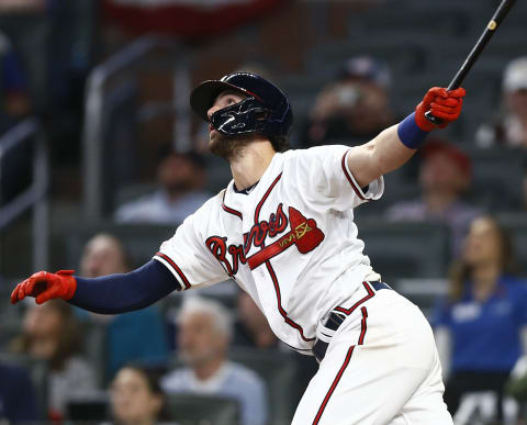 ATLANTA, GEORGIA – APRIL 03: Shortstop Dansby Swanson #7 of the Atlanta Braves hits a sacrifice fly in the eighth inning during the game against the Chicago Cubs on April 03, 2019 in Atlanta, Georgia. (Photo by Mike Zarrilli/Getty Images)