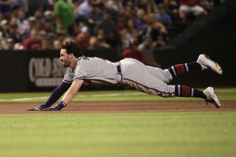 PHOENIX, ARIZONA – MAY 10: Dansby Swanson #7 of the Atlanta Braves dives for a triple in the fourth inning of the MLB game against the Arizona Diamondbacks at Chase Field on May 10, 2019 in Phoenix, Arizona. (Photo by Jennifer Stewart/Getty Images)