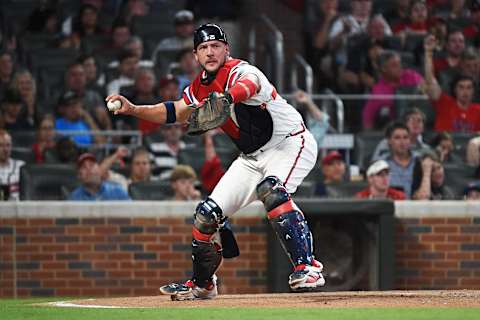 ATLANTA, GEORGIA – JUNE 15: Tyler Flowers #25 of the Atlanta Braves fields a ball against the Philadelphia Phillies at SunTrust Park on June 15, 2019 in Atlanta, Georgia. (Photo by Logan Riely/Getty Images)