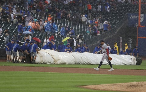 NEW YORK, NEW YORK – JUNE 29: The game between the New York Mets and the Atlanta Braves is delayed in the second inning at Citi Field on June 29, 2019 in New York City. (Photo by Al Bello/Getty Images)