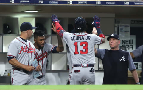 SAN DIEGO, CALIFORNIA – JULY 13: Ronald Acuna Jr. #13 is congratulated in the dugout after hitting a solo homerun during the seventh inning of a game against the San Diego Padres at PETCO Park on July 13, 2019 in San Diego, California. (Photo by Sean M. Haffey/Getty Images)