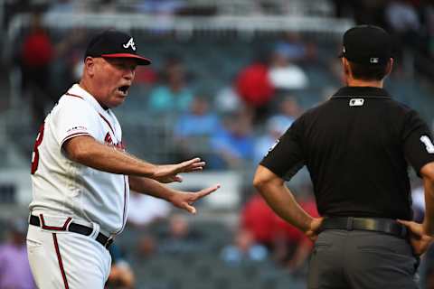 ATLANTA, GEORGIA – AUGUST 20: Brian Snitker #43 of the Atlanta Braves argues with the umpire after a play against the Miami Marlins at SunTrust Park on August 20, 2019 in Atlanta, Georgia. (Photo by Logan Riely/Getty Images)