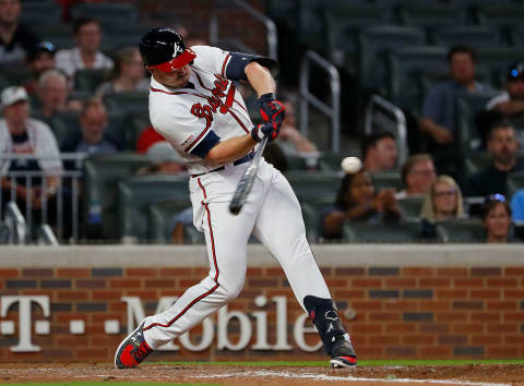 ATLANTA, GEORGIA: Adam Duvall #23 of the Atlanta Braves hits a solo homer in the ninth inning against the Philadelphia Phillies on September 17, 2019. (Photo by Kevin C. Cox/Getty Images)