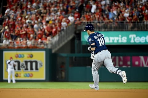 WASHINGTON, DC – OCTOBER 01: Yasmani  Grandal #10 of the Milwaukee Brewers celebrates after hitting a two run home run to score Trent Grisham #2 against Max Scherzer #31 of the Washington Nationals during the first inning in the National League Wild Card game at Nationals Park on October 01, 2019 in Washington, DC. (Photo by Will Newton/Getty Images)