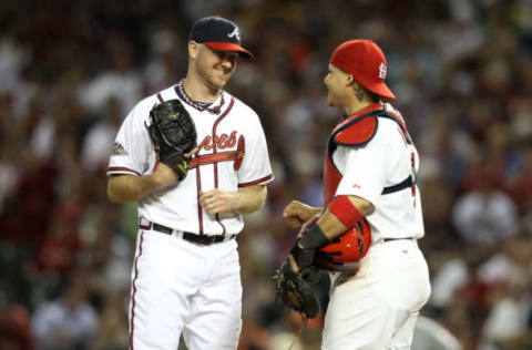 Jonny Venters #39 of the Atlanta Braves speaks with NL All-Star Yadier Molina #4 of the St. Louis Cardinals in the eighth inning of the 82nd MLB All-Star Game. (Photo by Christian Petersen/Getty Images)