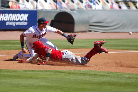 ATLANTA, GA – SEPTEMBER 30: Nick Castellanos #2 of the Cincinnati Reds is out at third with the tag of Austin Riley #27 of the Atlanta Braves in the sixth inning of Game One of the National League Wild Card Series at Truist Park on September 30, 2020 in Atlanta, Georgia. (Photo by Todd Kirkland/Getty Images)