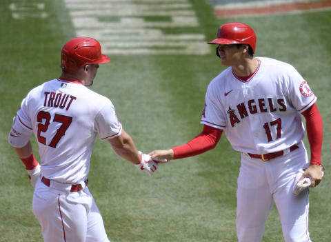 ANAHEIM, CALIFORNIA – APRIL 06: Mike Trout #27 of the Los Angeles Angels celebrates his two run homerun with Shohei Ohtani #17, to take a 2-0 lead over the Houston Astros during the first inning at Angel Stadium of Anaheim on April 06, 2021 in Anaheim, California. (Photo by Harry How/Getty Images)
