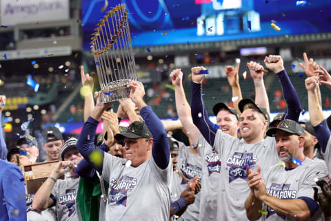 HOUSTON, TEXAS – NOVEMBER 02: Manager Brian Snitker #43 of the Atlanta Braves hoists the commissioner’s trophy following the team’s 7-0 victory against the Houston Astros in Game Six to win the 2021 World Series at Minute Maid Park on November 02, 2021 in Houston, Texas. (Photo by Carmen Mandato/Getty Images)