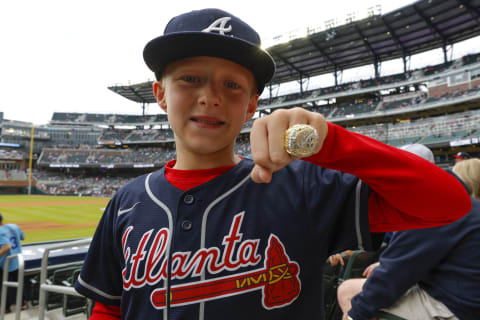 This Atlanta Braves fan may not design his ring, but he loves this one. (Photo by Todd Kirkland/Getty Images)