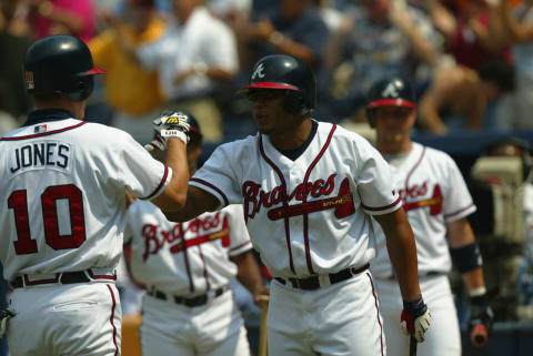 ATLANTA - SEPTEMBER 11: Left fielder Chipper Jones #10 of the Atlanta Braves receives congratulations from center fielder Andruw Jones #25 after one of his two home runs during the first game of a MLB double-header against the New York Mets on September 11, 2002 at Turner Field in Atlanta, Georgia. The Braves won 8-5. (Photo by Jamie Squire/Getty Images)