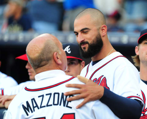 Nick Markakis informing Leo Mazzone about the benefits of decaf. (Photo by Scott Cunningham/Getty Images)