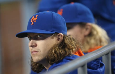 LOS ANGELES, CALIFORNIA – MAY 12: Pitchers Jacob DeGrom #48 (L) and Noah Syndergaard #34 of the New York Mets sit in the dugout between starts during the game against the Los Angeles Dodgers at Dodger Stadium on May 12, 2016 in Los Angeles, California. The Dodgers won 5-0. (Photo by Stephen Dunn/Getty Images)