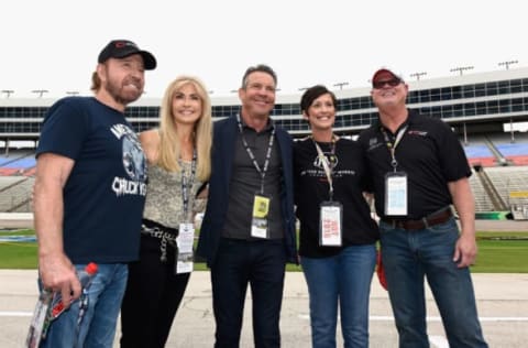 FORT WORTH, TX – NOVEMBER 06: (L-R) Actor Chuck Norris, Gena O’Kelley, actor Dennis Quaid, Shawna Morris and former Tampa Bay Devil Rays relief pitcher Jim Morris pose prior to the NASCAR Sprint Cup Series AAA Texas 500 at Texas Motor Speedway on November 6, 2016 in Fort Worth, Texas. (Photo by Jared C. Tilton/Getty Images)