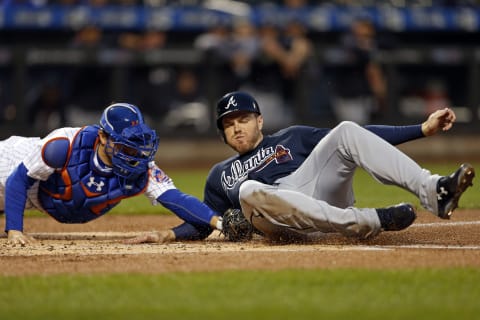 NEW YORK, NY – APRIL 26: Freddie  Freeman #5 of the Atlanta Braves scores a run in front of Travis  d’Arnaud #18 of the New York Mets during the first inning at Citi Field on April 26, 2017 in the Flushing neighborhood of the Queens borough of New York City. (Photo by Adam Hunger/Getty Images)