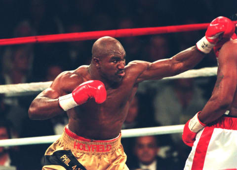 4 Nov 1995: Evander Holyfield misses with a right jab to opponnent Riddick Bowe during their bout at Caesars Palace in Las Vegas, Nevada. Bowe won the bout by TKO in round 6. Mandatory Credit: Al Bello/ALLSPORT