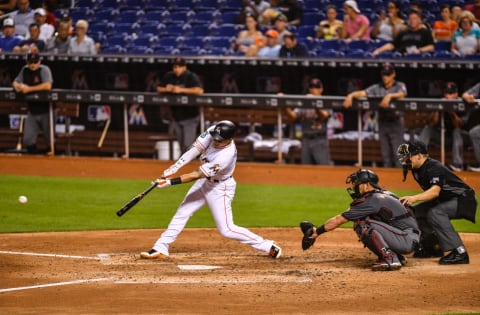 MIAMI, FL – JUNE 25: Derek Dietrich #32 of the Miami Marlins singles for an RBI in the fourth inning during the game against the Arizona Diamondbacks at Marlins Park on June 25, 2018 in Miami, Florida. (Photo by Mark Brown/Getty Images)
