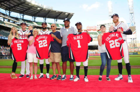 (L-R Freddie Freeman #5, Nick Markakis #22, Ozzie Albies #1, and Mike Foltynewicz #26)of the Atlanta Braves pose for a photograph with their families. (Photo by Scott Cunningham/Getty Images)