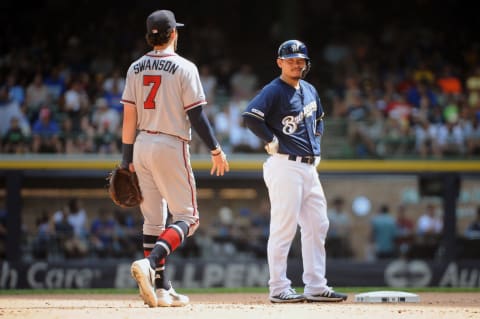 Milwaukee Brewers second baseman Keston Hiura and Atlanta Braves shortstop Dansby Swanson. Mandatory Credit: Michael McLoone-USA TODAY Sports