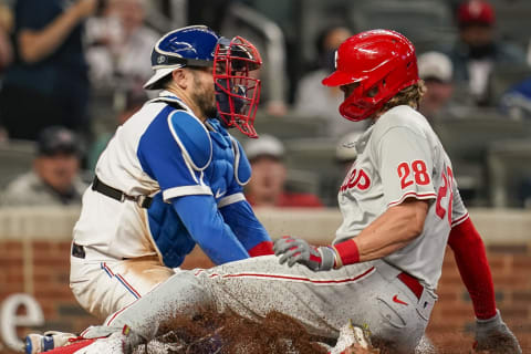 Philadelphia Phillies third baseman Alec Bohm scores(?) a run ahead of the tag by Atlanta Braves catcher Travis d’Arnaud. Mandatory Credit: Dale Zanine-USA TODAY Sports