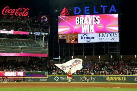 Blooper waves a Braves flag after a Atlanta Braves win. Mandatory Credit: Jason Getz-USA TODAY Sports