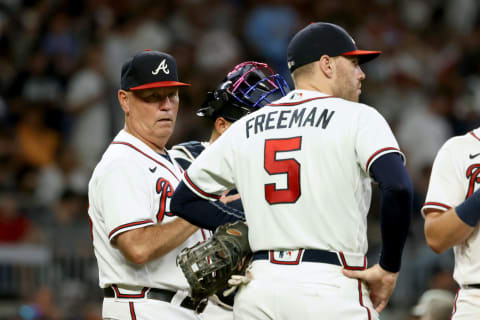 Atlanta Braves manager Brian Snitker stands on the mound with first baseman Freddie Freeman during a pitching change. Mandatory Credit: Jason Getz-USA TODAY Sports