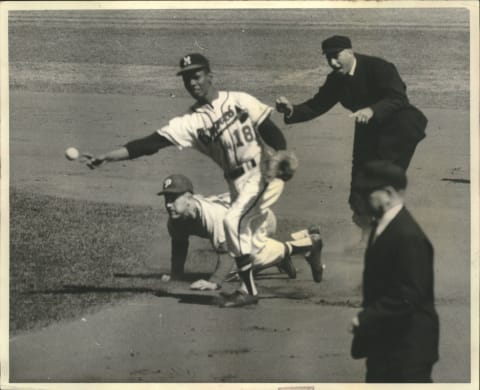 Sixty years before Atlanta Braves All-Star Ozzie Albies manned second base Felix Mantilla turned double plays for the Milwaukee Braves. 1959 Press Photo Braves Felix Mantilla Tags Out Phillies Player