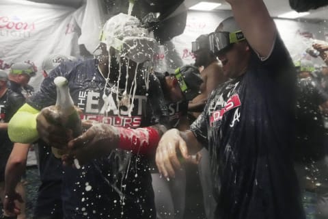 Atlanta Braves celebrate winning the NL East division for the fifth consecutive year. Mandatory Credit: Jim Rassol-USA TODAY Sports