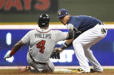 Apr 29, 2017; Milwaukee, WI, USA; Milwaukee Brewers shortstop Orlando Arcia (3) tags out Atlanta Braves second baseman Brandon Phillips (4) trying to stretch a base hit into a double in the second inning at Miller Park. Mandatory Credit: Benny Sieu-USA TODAY Sports