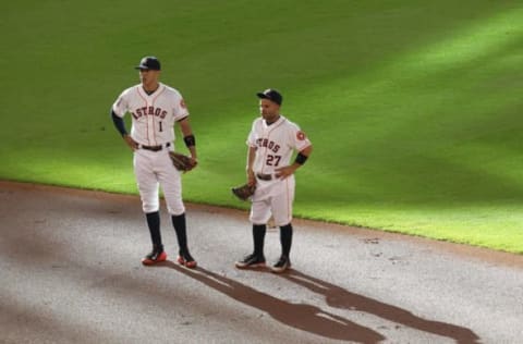 Aug 1, 2015; Houston, TX, USA; Houston Astros shortstop Carlos Correa (1) and Houston Astros second baseman Jose Altuve (27) talk waiting for the Arizona Diamondbacks getting ready to bat at Minute Maid Park. Mandatory Credit: Thomas B. Shea-USA TODAY Sports