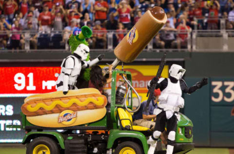 Jul 21, 2016; Philadelphia, PA, USA; The Phillie Phanatic and star wars characters shoot hot dogs into the crowd during a break in the action between the Philadelphia Phillies and the Miami Marlins at Citizens Bank Park. The Miami Marlins won 9-3. Mandatory Credit: Bill Streicher-USA TODAY Sports