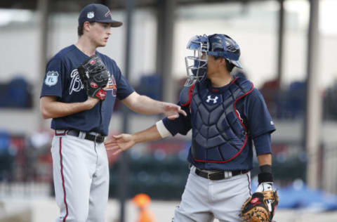 Feb 27, 2017; Lakeland, FL, USA; Atlanta Braves starting pitcher Max Fried (left) talks on the mound with catcher Kurt Suzuki (right) during the sixth inning of a spring training baseball game against the Detroit Tigers at Joker Marchant Stadium. Mandatory Credit: Reinhold Matay-USA TODAY Sports